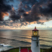 Vertical Lighthouse At Sunset by jgpittenger