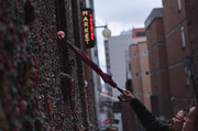 22nd Feb 2014 - Placing The Gum On The Gum Wall At The Market