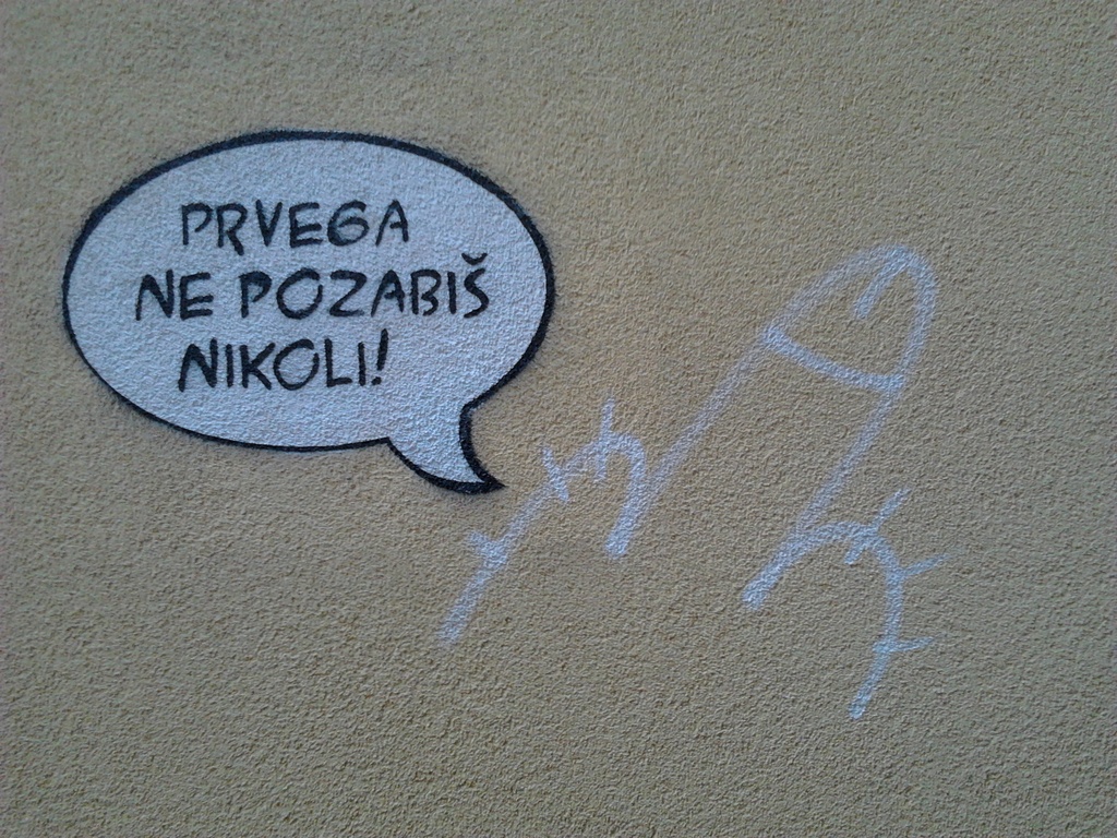 a graffiti next to a graffiti by zardz