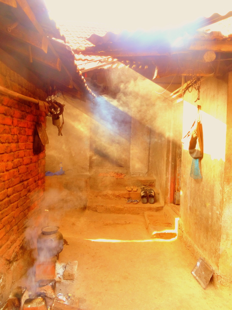 Sunlight and Smoke in the village by amrita21