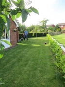 19th May 2014 - Son, Chris, cutting the lawn on his afternoon off.