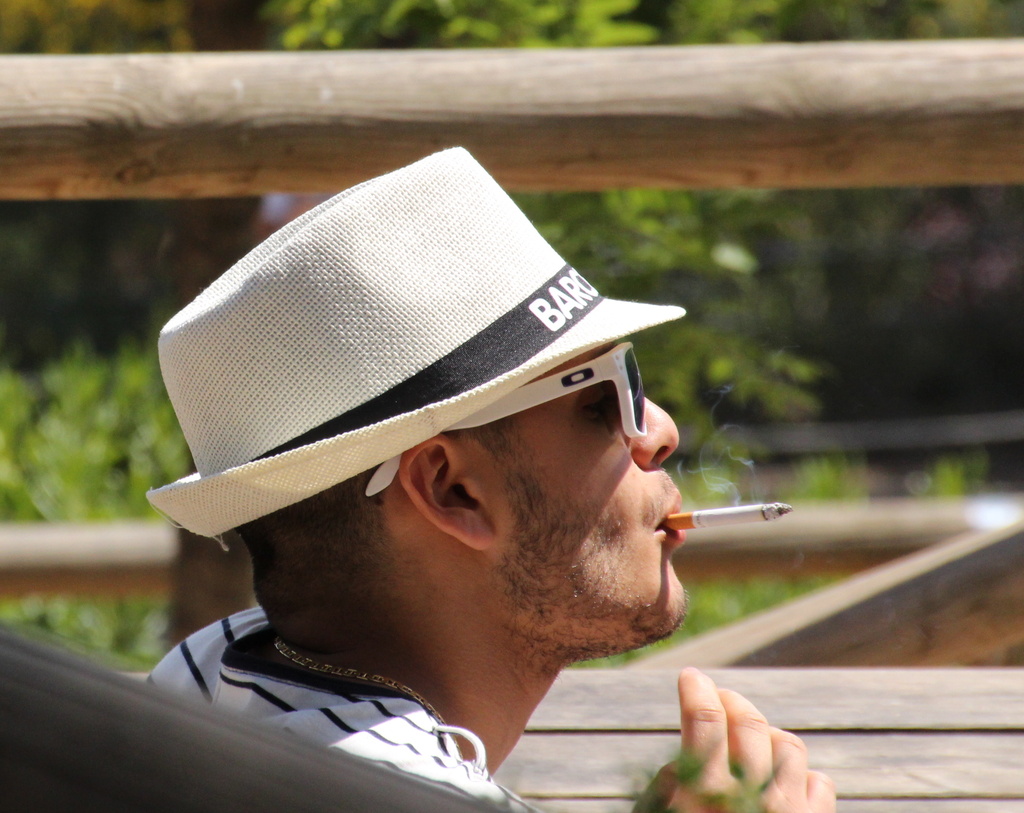 man in hat with cigarette by busylady