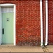 Two White Poles; One Green Door by olivetreeann