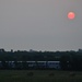 Train, Bales, and Morning Sun by kareenking