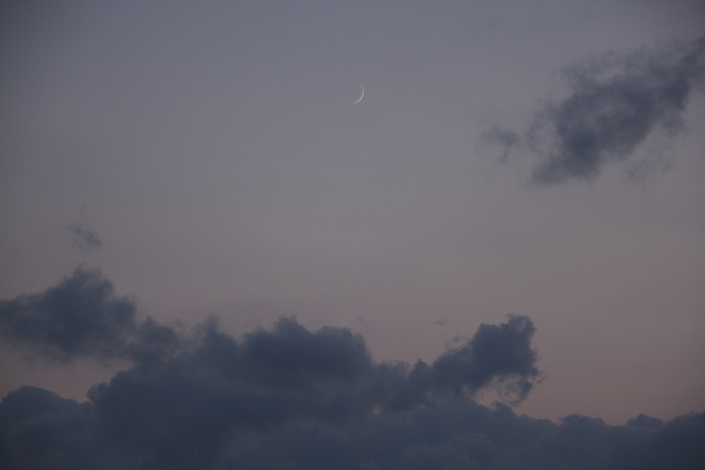 Crescent moon and clouds by randystreat