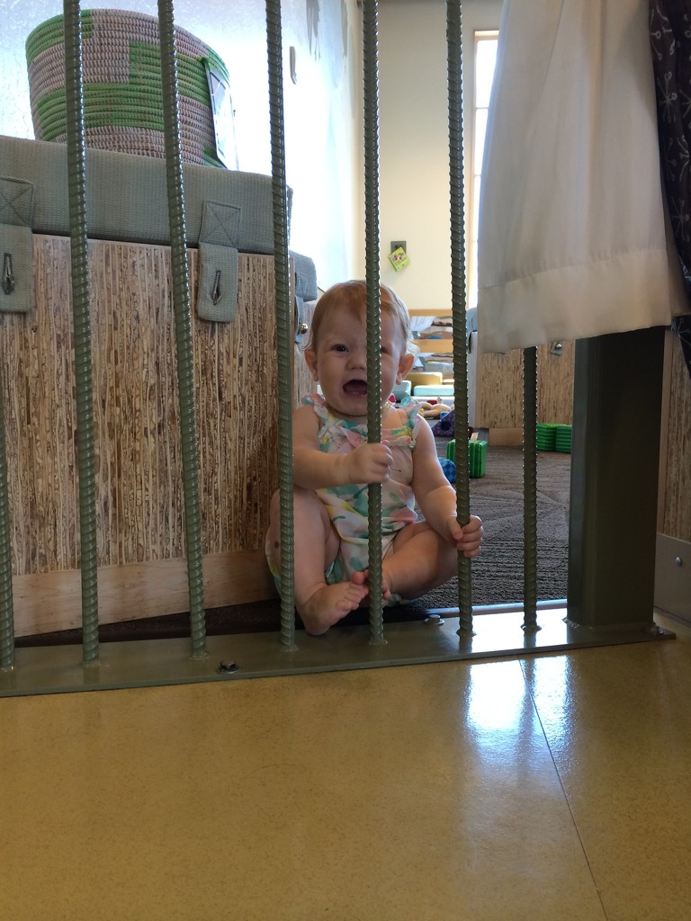 Pretending she's in baby prison on her first visit to the Phoenix Children's Museum by doelgerl