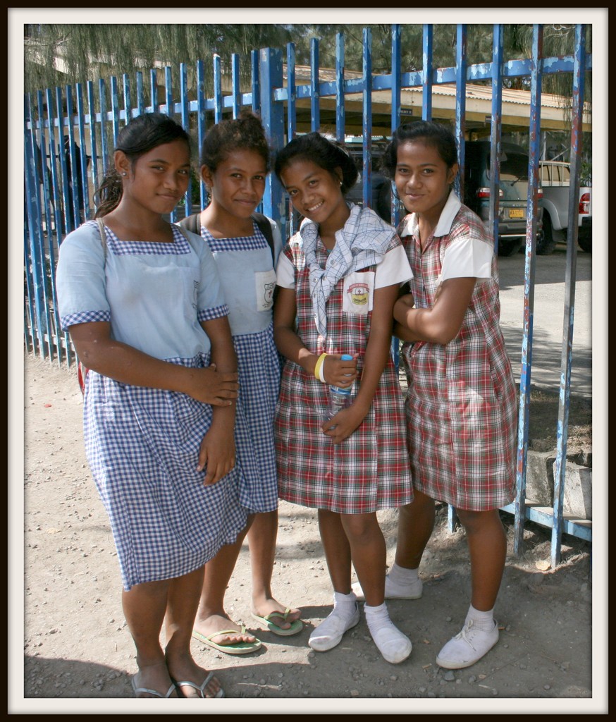 happy Honiara schoolgirls by cruiser