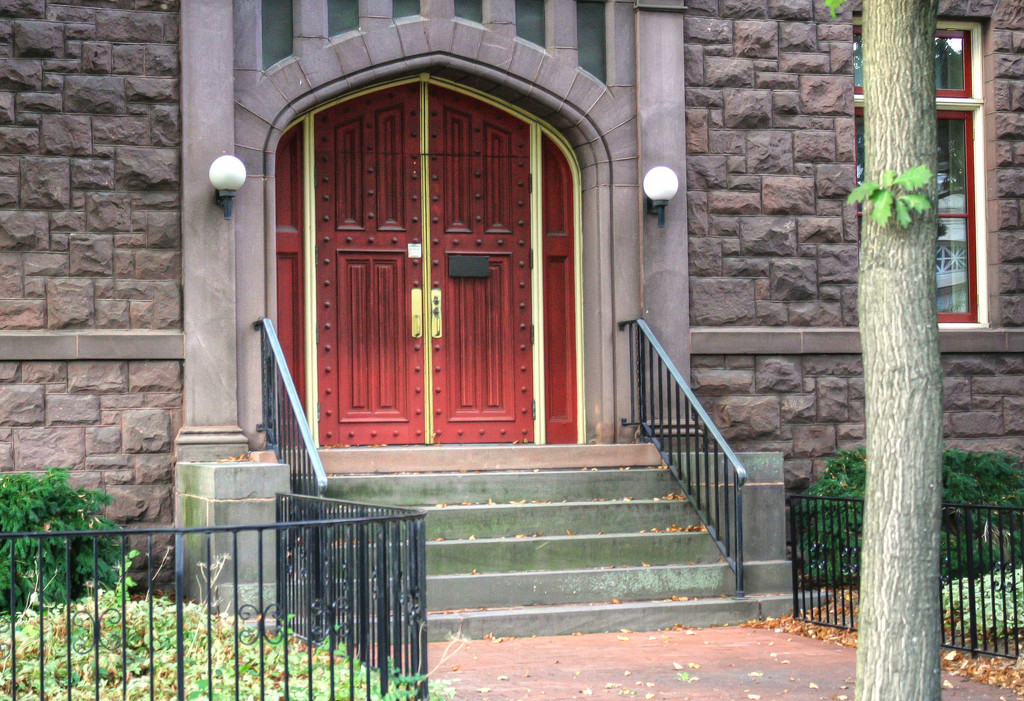 Red church door by mittens