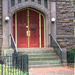 Red church door by mittens