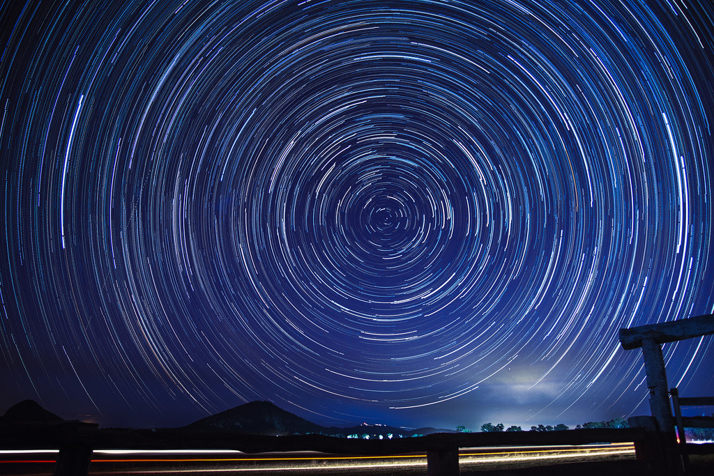 Star trails and car light trails at Lake Mary by jeneurell