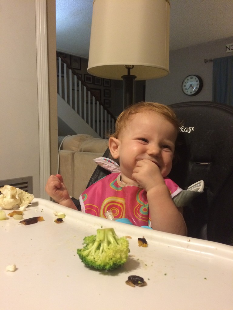 Laughing at the mention of finishing her broccoli by doelgerl