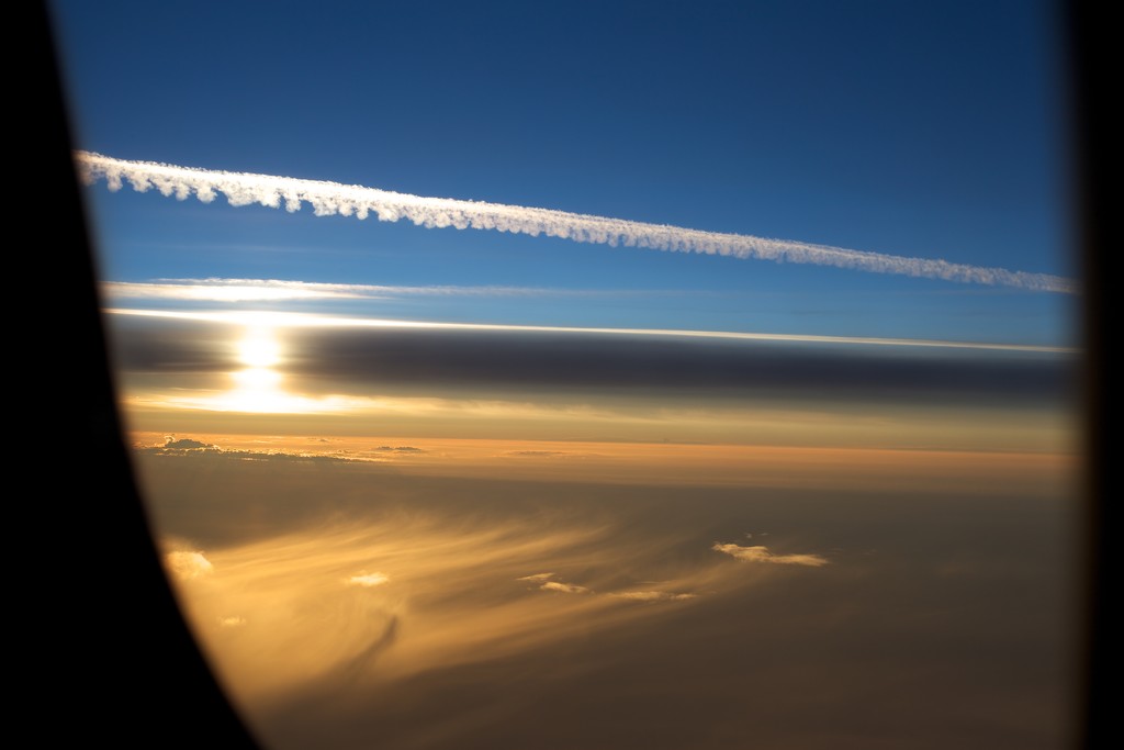 Sunrise from Airplane Window by jyokota