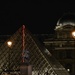 Red neon inside the Louvre Pyramid by parisouailleurs