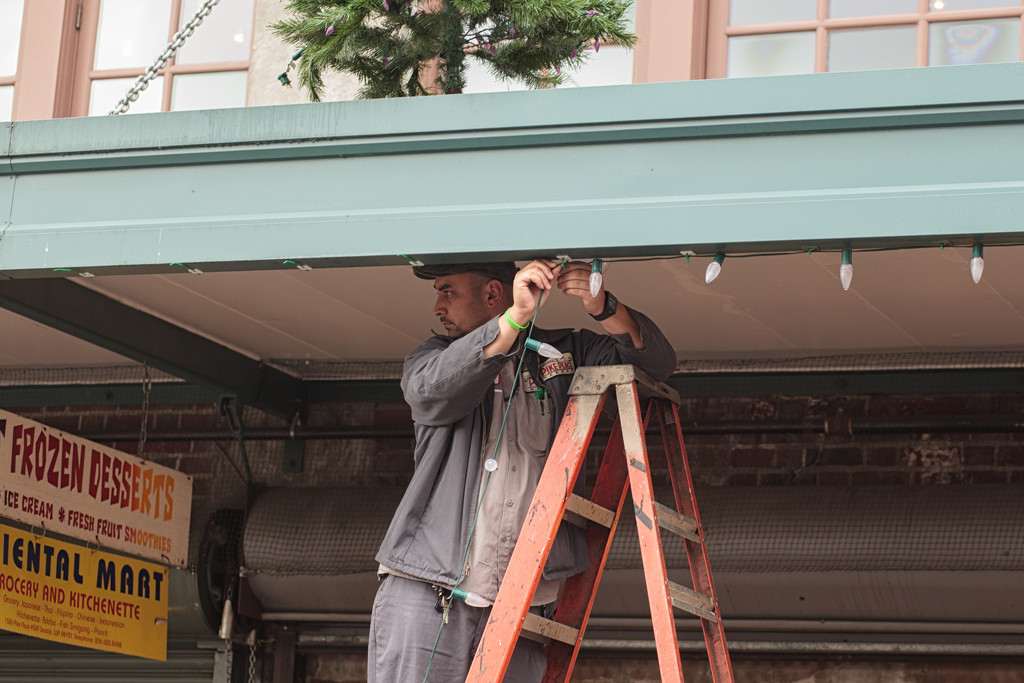 Hanging The Holiday Lights At The Market by seattle