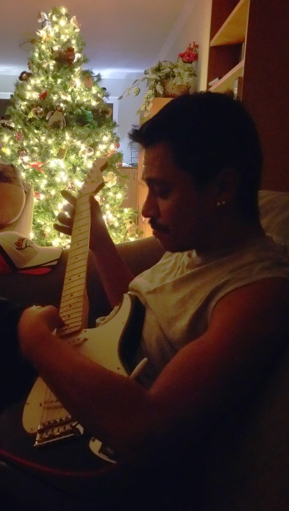 Luis Playing Guitar by mariaostrowski