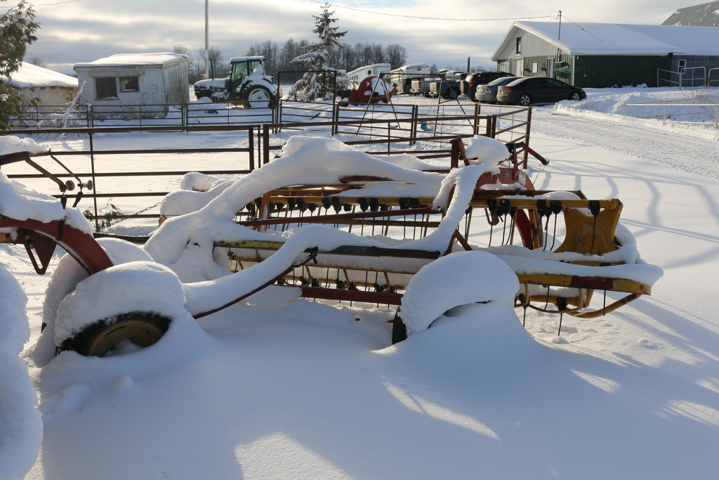 Farm machinery in the snow. by hellie