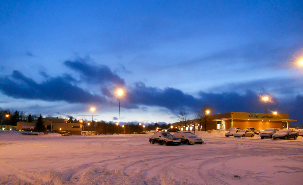 Snowy parking lot by mittens