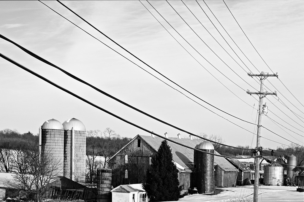 Farm beside the electric lines by francoise