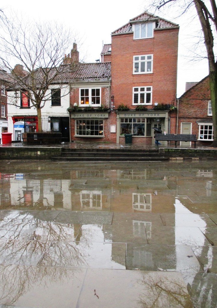 Rain and Reflections in Kings Square, York by fishers