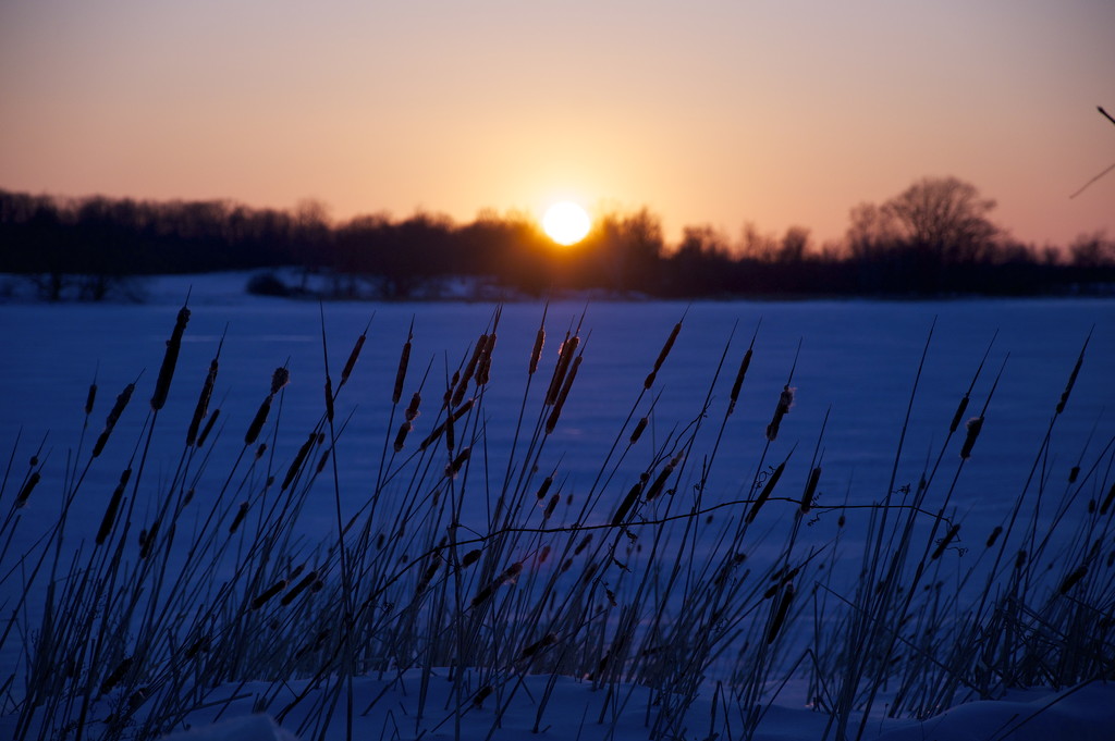 Sun setting behind Howe Island by frantackaberry