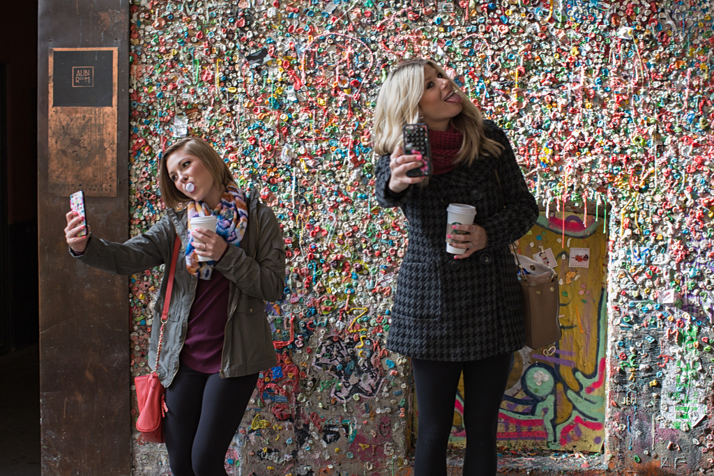 Selfies In Front Of The Alibi Room At The Gum Wall by seattle