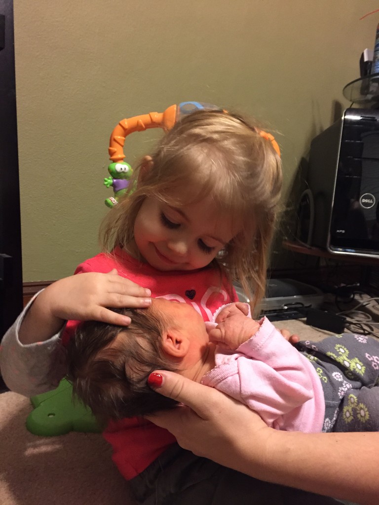 Loves holding her baby sister by mdoelger