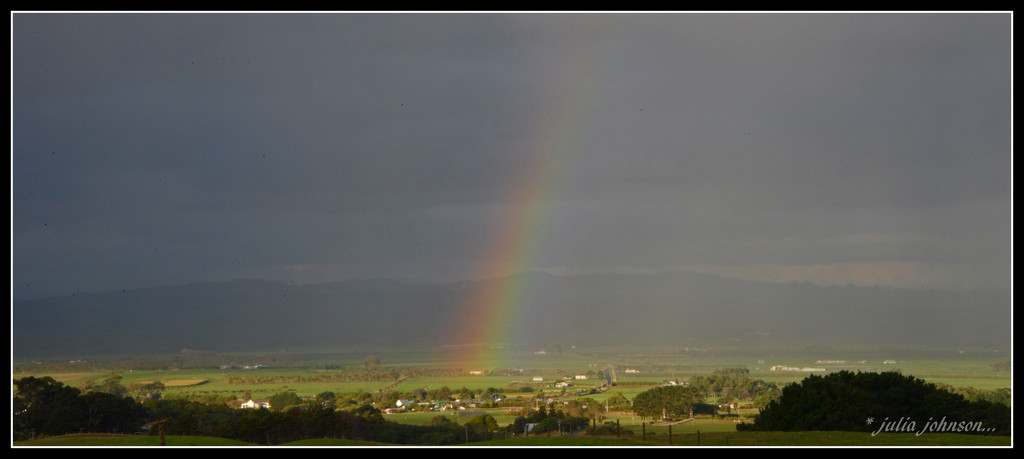 Rainbow over the village by julzmaioro