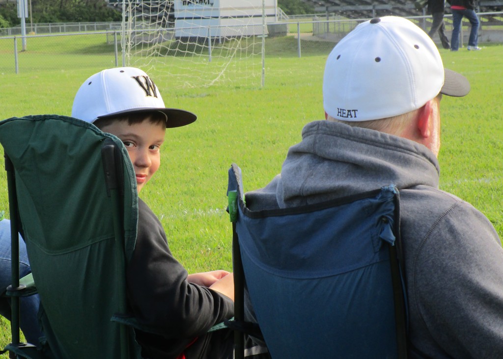 Watching His Sister Play Soccer by tunia