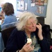 Art club Mary celebrating her 80th birthday with cream cake by jennymdennis