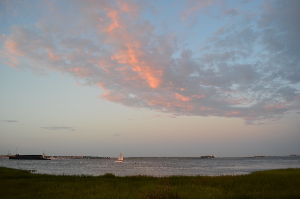 Sailboat, barge and container ship in Charleston Harbor at sunset, Charleston, SC.  This was taken at Waterfront Park and there were many vessels of great variety in the Harbor that afternoon. by congaree