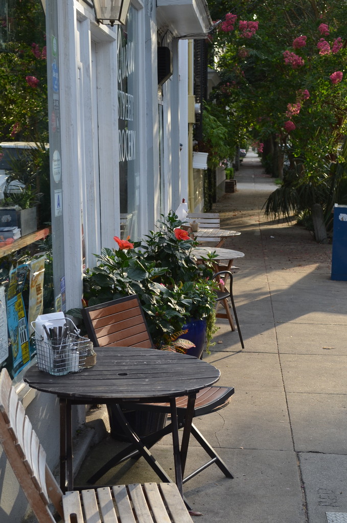 Sidewalk table for dining at the Queen Street Grocery, historic district, Charleston, SC by congaree