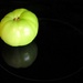 Reflections of a green tomato on my kitchen stove.... by homeschoolmom