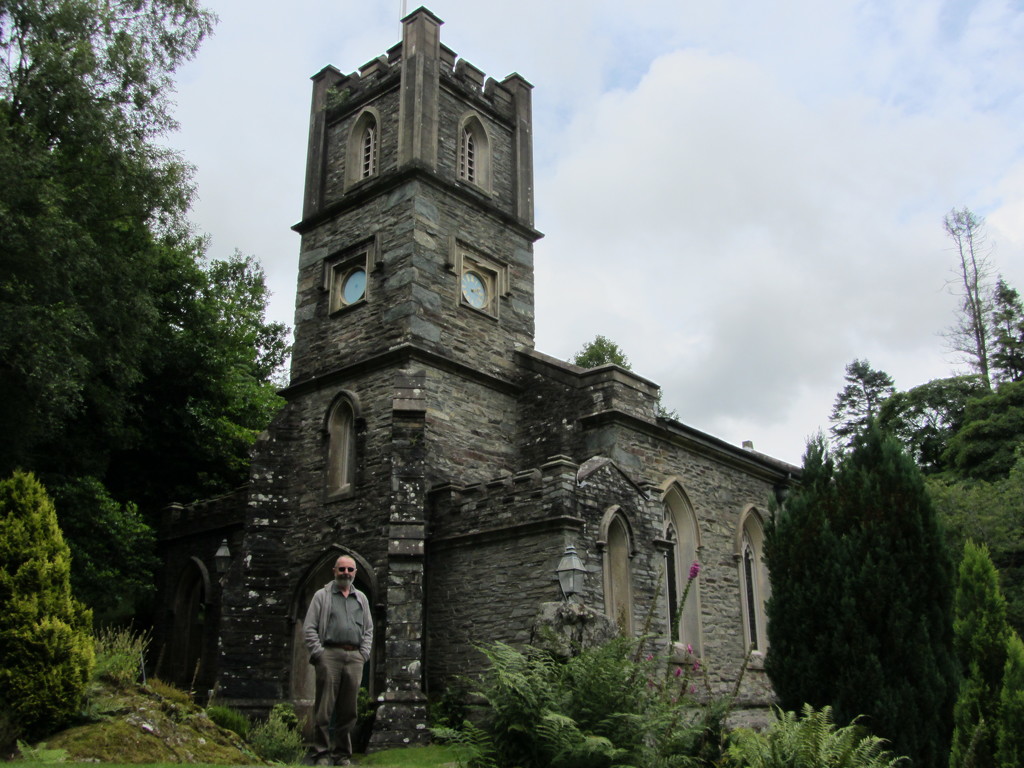 My husband standing by St. Mary church, Rydal. by grace55