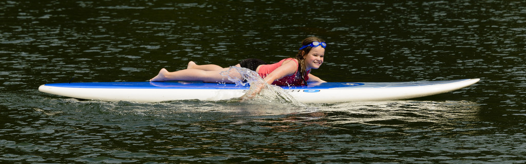 Rachel Brings In the Paddle Board  by jgpittenger