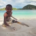 Boy on Bidadari Island off Labuan Bajo in Flores by lily
