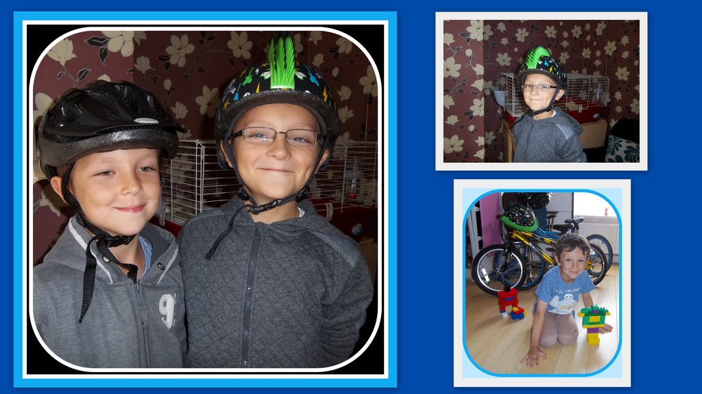 Corey and Tyler wearing their cycling helmets. by grace55