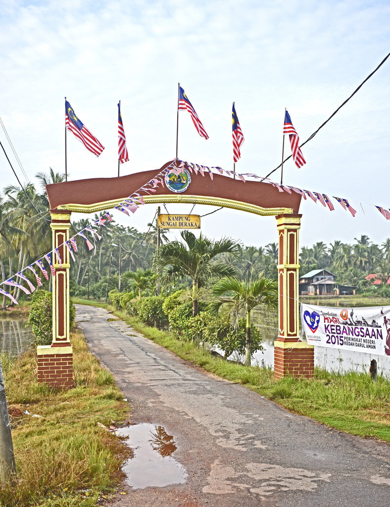 Merdeka flags on Kampung gateway by ianjb21