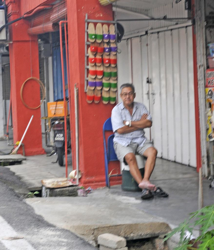 Shoe trader taking a rest by ianjb21