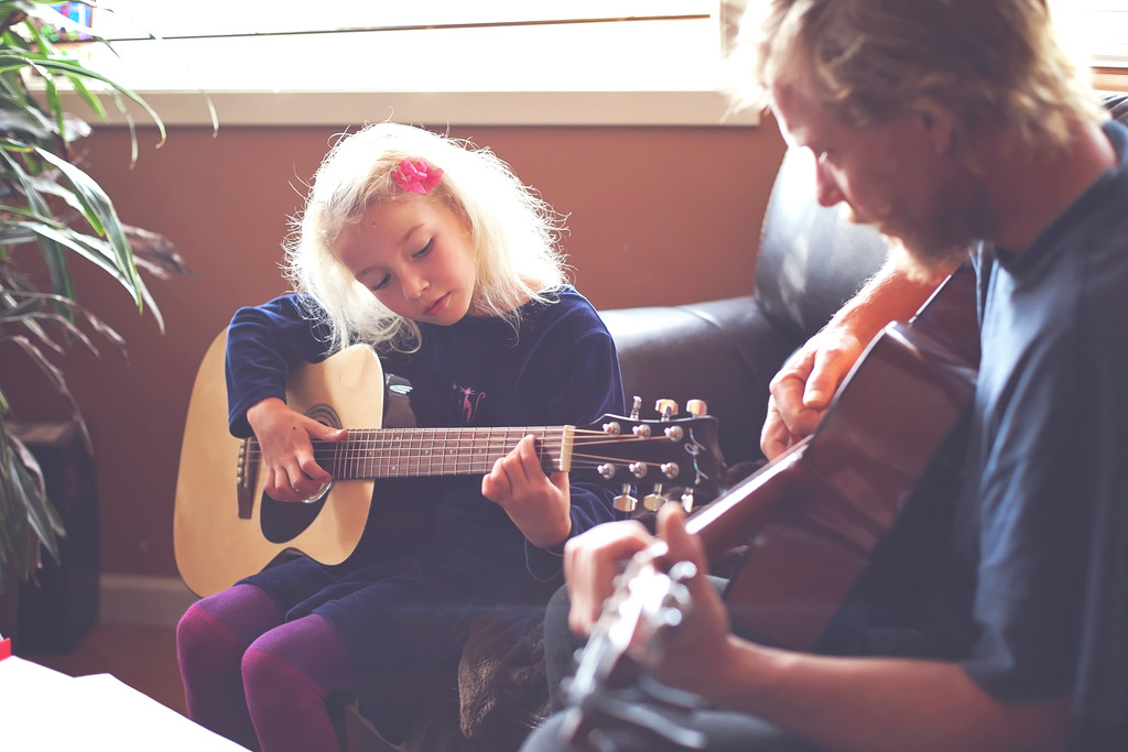 Guitar practice with Dad by kiwichick