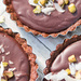 Chocolate and coconut tart with pistachio topping  by nicolecampbell