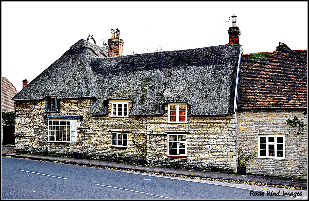 Stone and thatched cottage in Pavenham by rosiekind