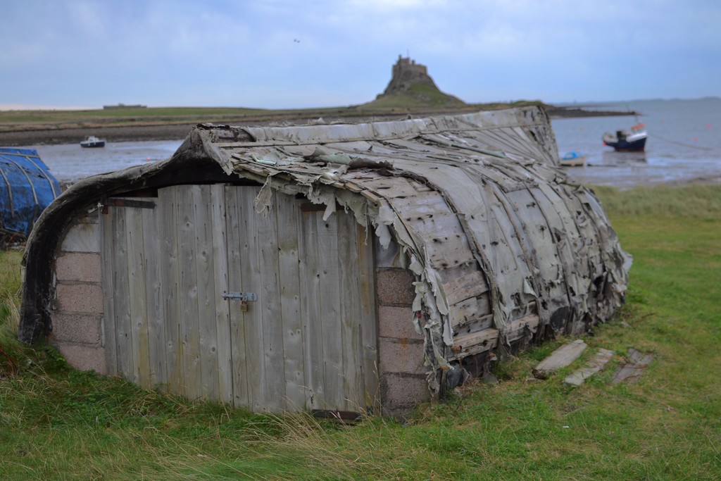 Boat shed and castle, Lindisfarne by tomdoel