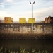 Yellow containers behind lego brick wall by mastermek