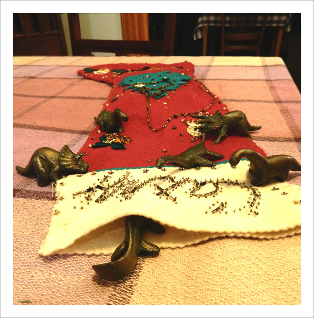 Dinosaurs explore the Christmas stocking by mcsiegle