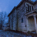Abandoned farmhouse at twilight by ggshearron