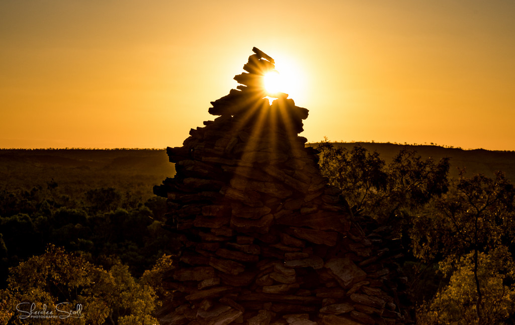 Sunflare on a giant cairn by bella_ss