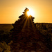 Sunflare on a giant cairn by bella_ss
