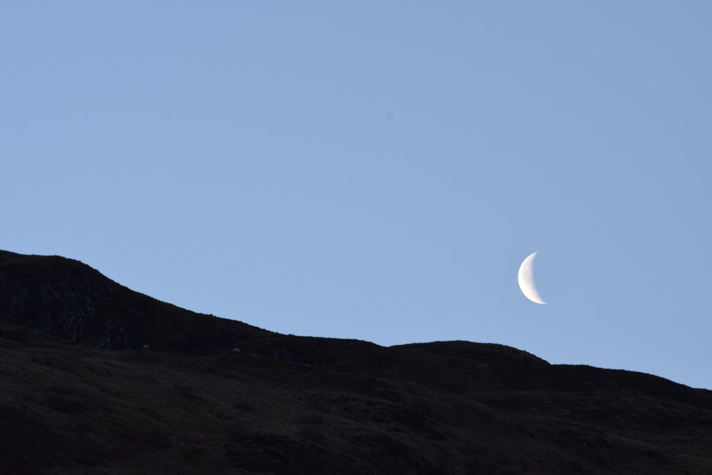 moon setting behind Creag na h-Iolaire by christophercox
