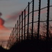 A Fence and a Funnel - A Kansas Sunset by kareenking