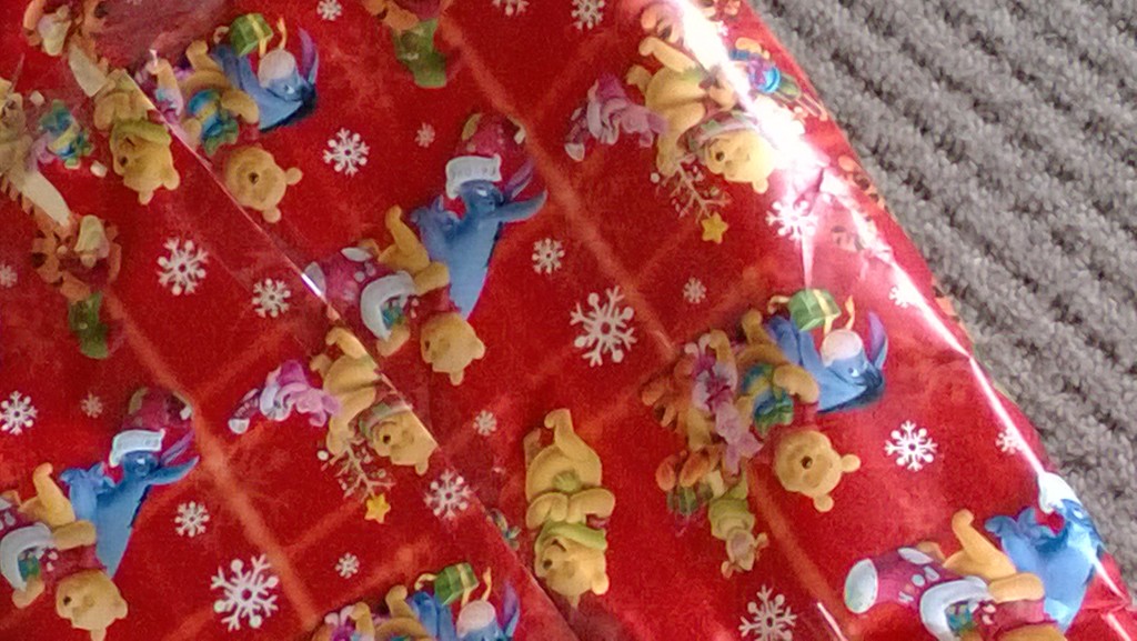 Used up old Christmas paper to wrap Joshee's birthday presents  by cataylor41
